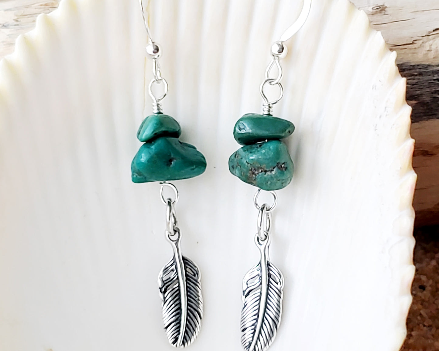 Turquoise Feather dangle earrings with rare, deep greenish vintage turquoise nuggets & sterling silver feather pendants with shell background