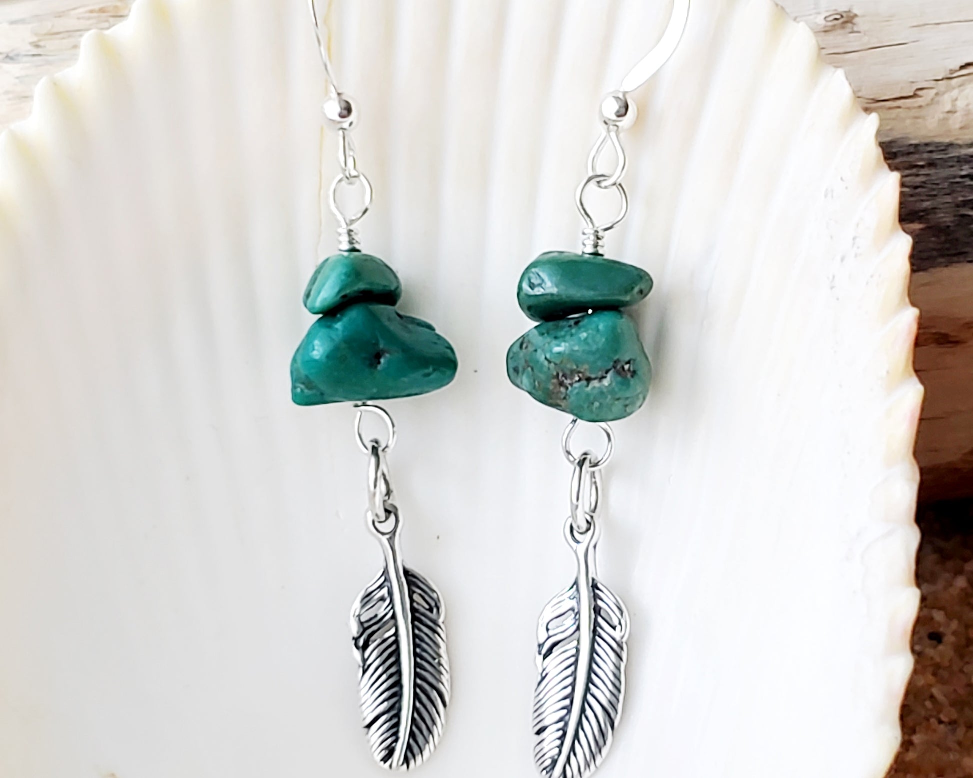 Turquoise Feather dangle earrings with rare, deep greenish vintage turquoise nuggets & sterling silver feather pendants with shell background