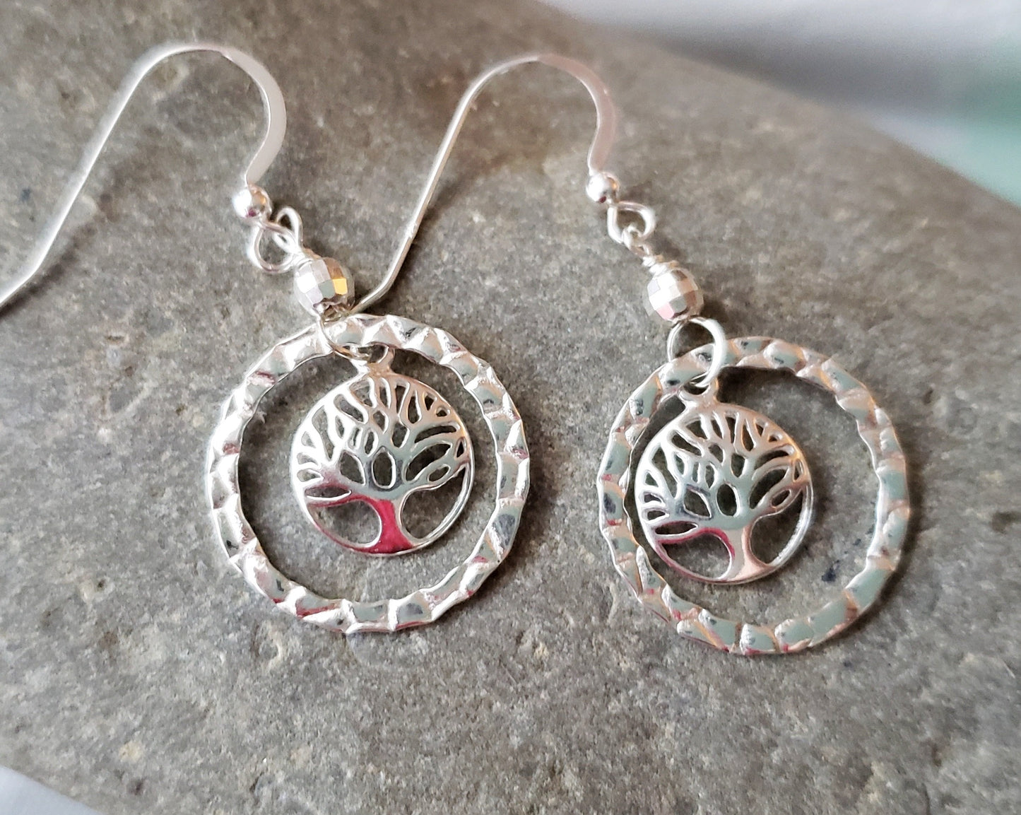 Long Sterling Silver Tree of Life Eternity Earrings. Tree of Life pendants dangle inside textured Eternity Rings