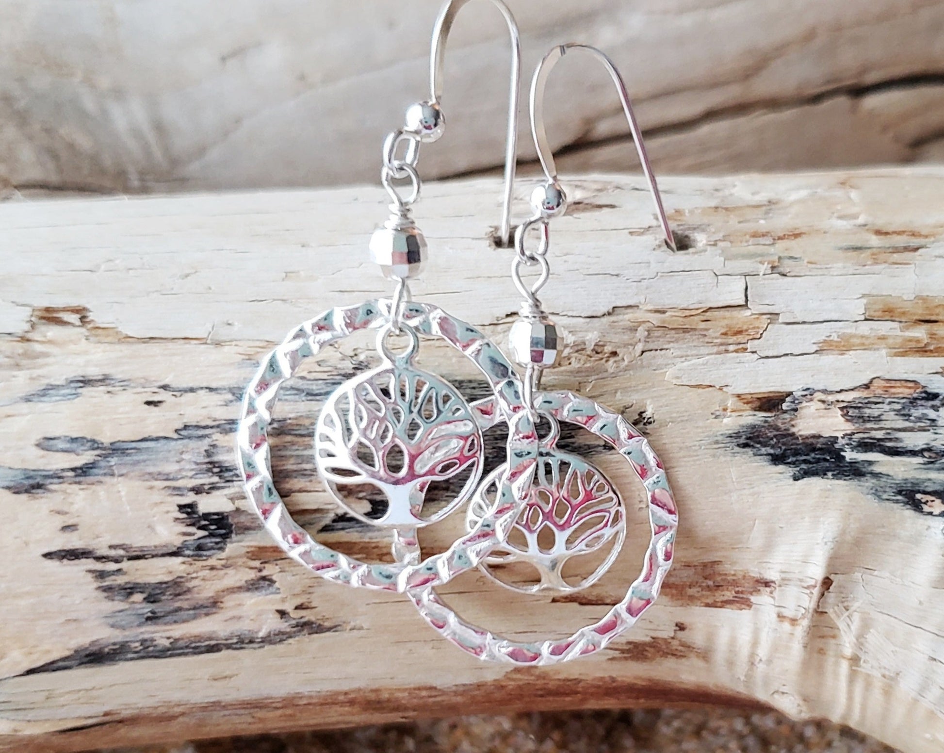 Long Sterling Silver Tree of Life Eternity Earrings. Tree of Life pendants dangle inside textured Eternity Rings