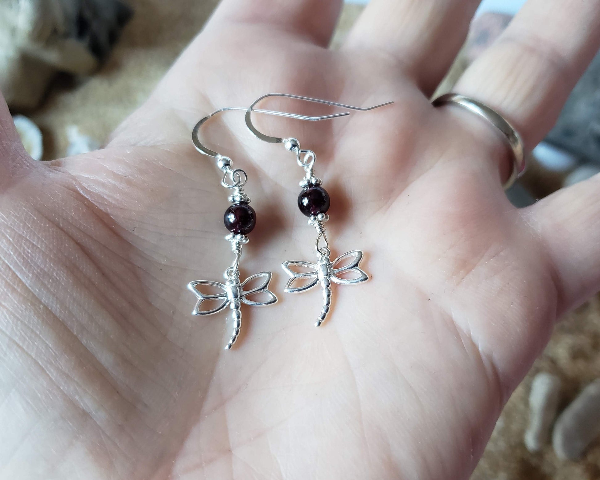 Dragonfly Garnet Delight Earrings, Sterling Silver earrings in hand