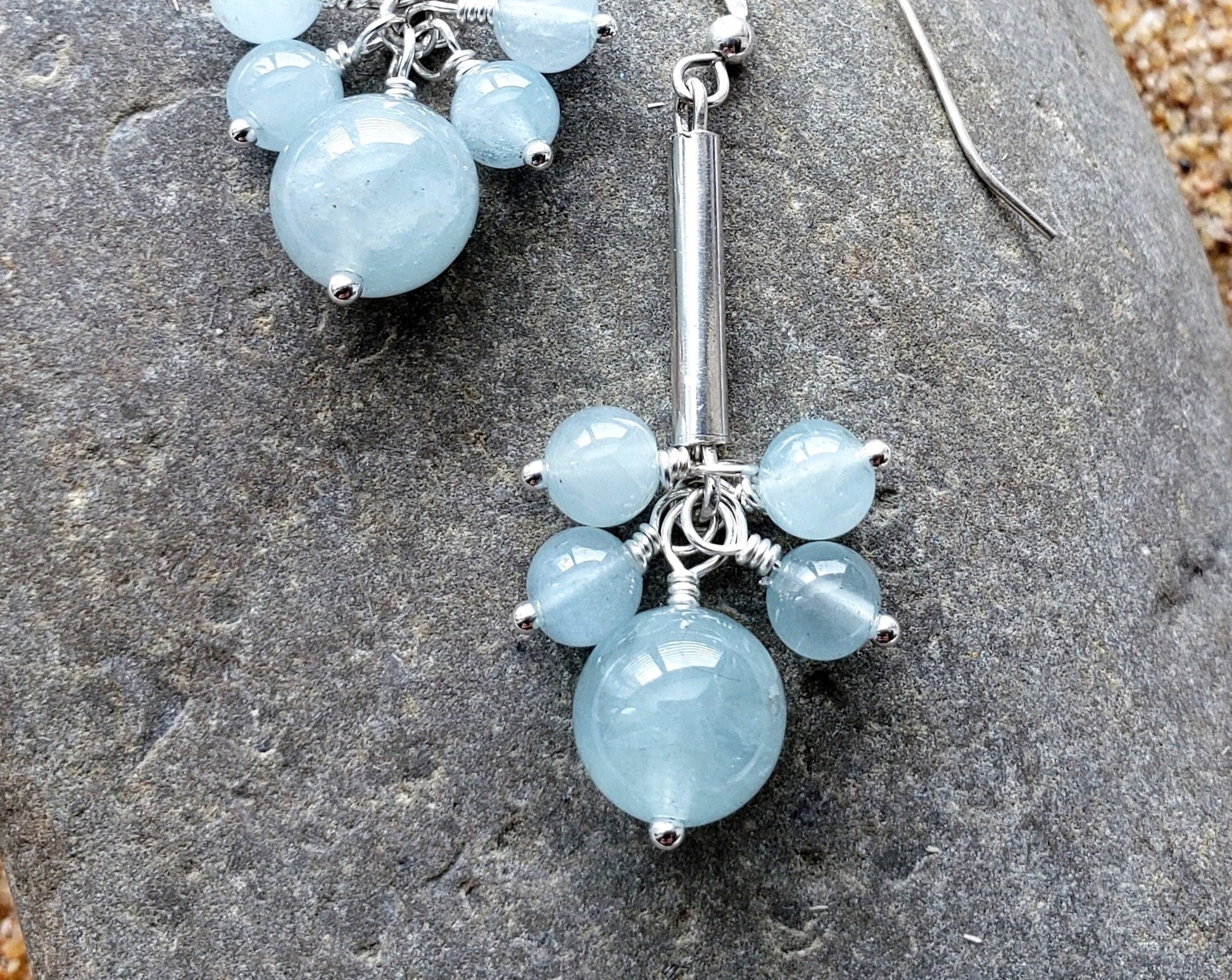 Long Dangly Aquamarine Earrings with five Aquamarine stones dangling from a long Sterling Silver tube. 