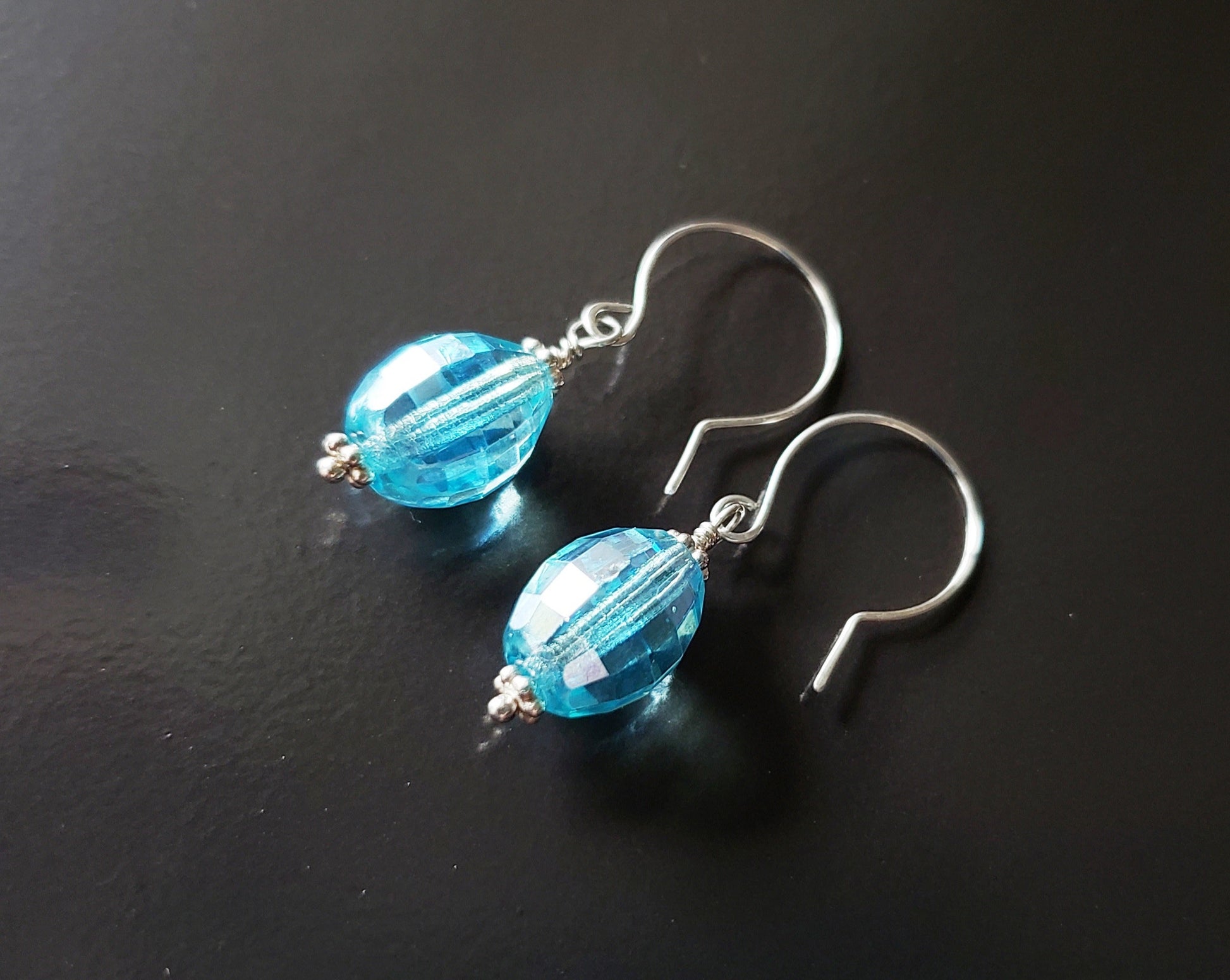 Brilliant Aqua Blue Crystal Drop Earrings made with solid Sterling Silver and sparkly oval shaped faceted aqua blue Vintage Crystal