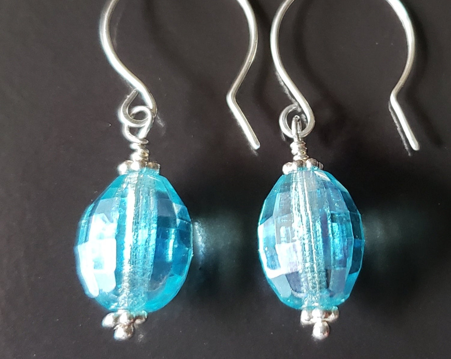 Brilliant Aqua Blue Crystal Drop Earrings made with solid Sterling Silver and sparkly oval shaped faceted aqua blue Vintage Crystal