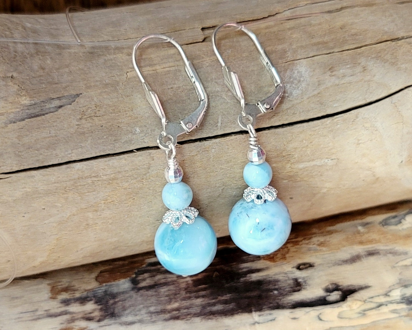 Deluxe Larimar Beach Paradise Earrings, Long Dangle blue Gemstone Earrings on lever back earring hooks, displayed on beach wood. 