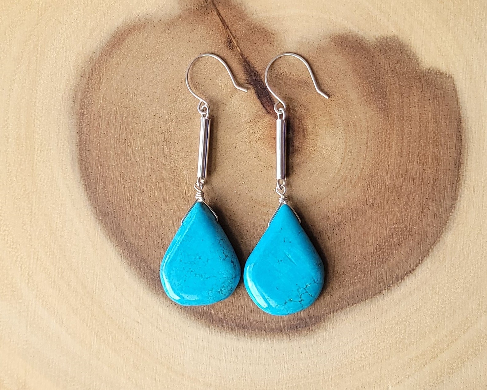 Long Turquoise Howlite Art Deco Style Drop Earrings, large drop shaped stones on thin Sterling Silver tubes, dangling from french hooks. 