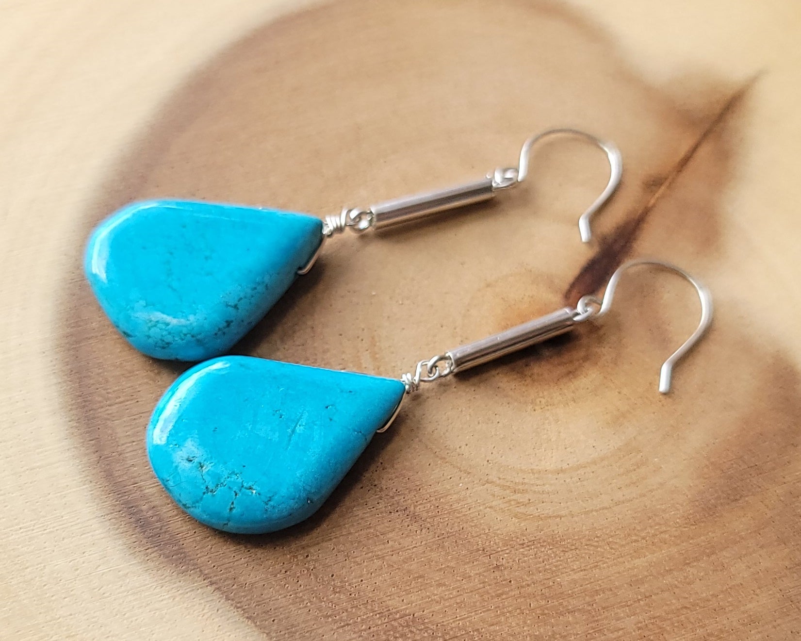 Long Turquoise Howlite Art Deco Style Drop Earrings, large drop shaped stones on thin Sterling Silver tubes, dangling from french hooks. 