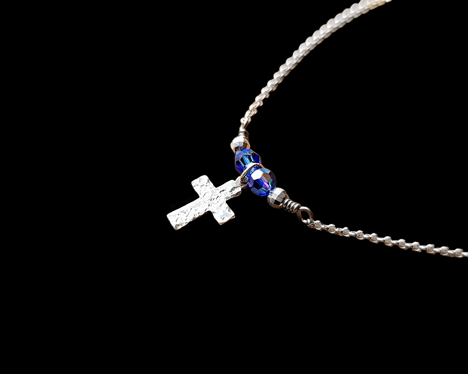 Sterling Silver Cross with small birthstone color crystals on either side, on a fine sterling silver fine Rolo Chain.
