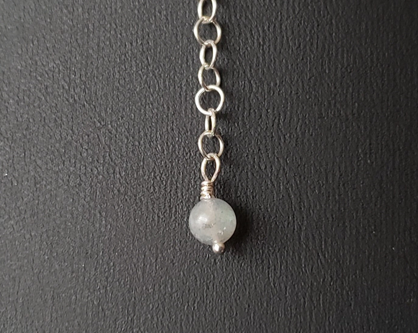 Lbaradorite dangle on the end of the back extension chain