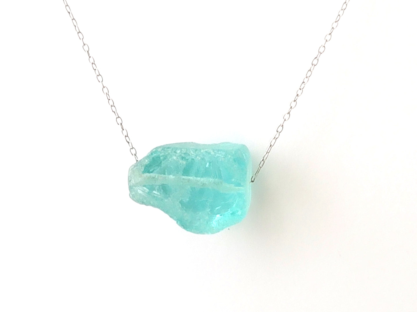 Aqua Quartz Crystal Nugget Minimalist Necklace, a rough Blue Quartz nugget on an Upcycled Vintage Sterling Silver chain, on white background