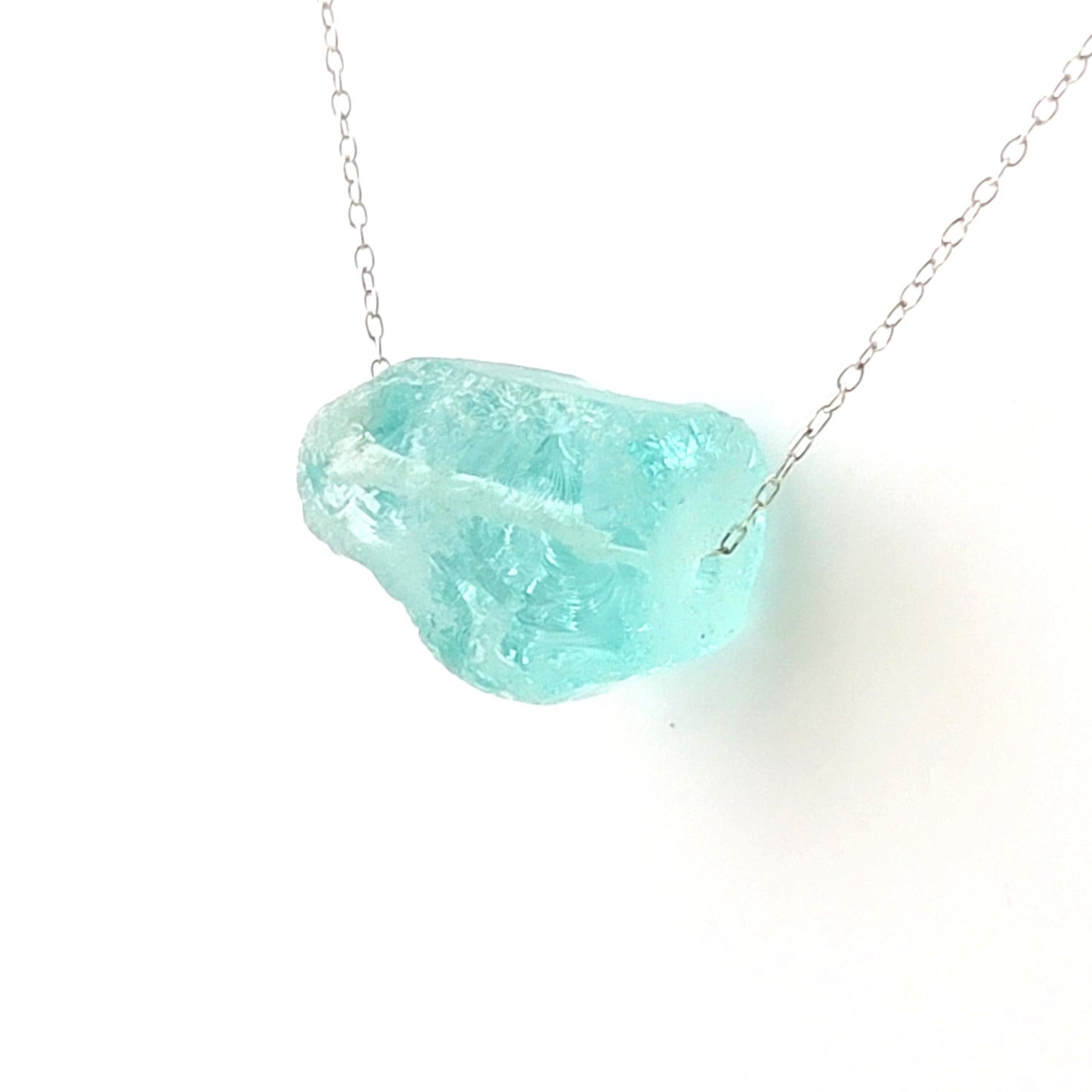 Aqua Quartz Crystal Nugget Minimalist Necklace, a rough Blue Quartz nugget on an Upcycled Vintage Sterling Silver chain, on white background